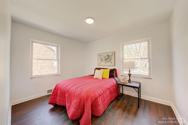 bedroom featuring dark wood-type flooring