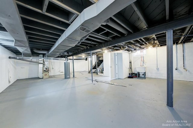 13966 Warwick St, Detroit, MI 48223 - unfinished basement with water heater and heating unit
