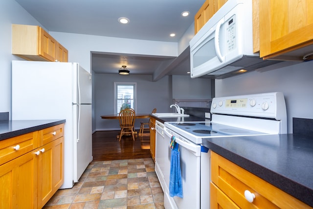 kitchen with white appliances and sink