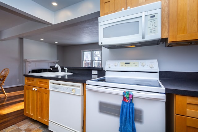 kitchen featuring sink and white appliances