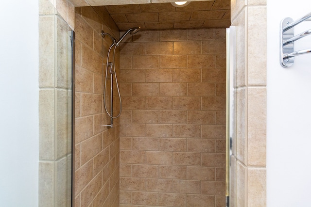 bathroom with a tile shower