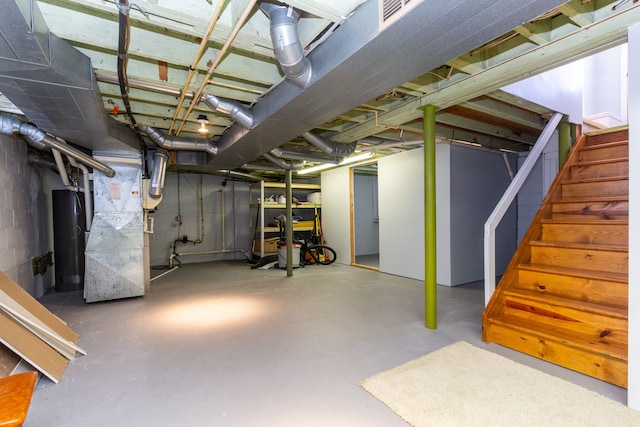 basement with heating unit and water heater