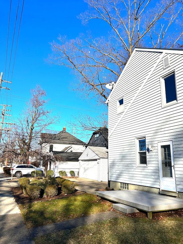 view of side of home with a garage