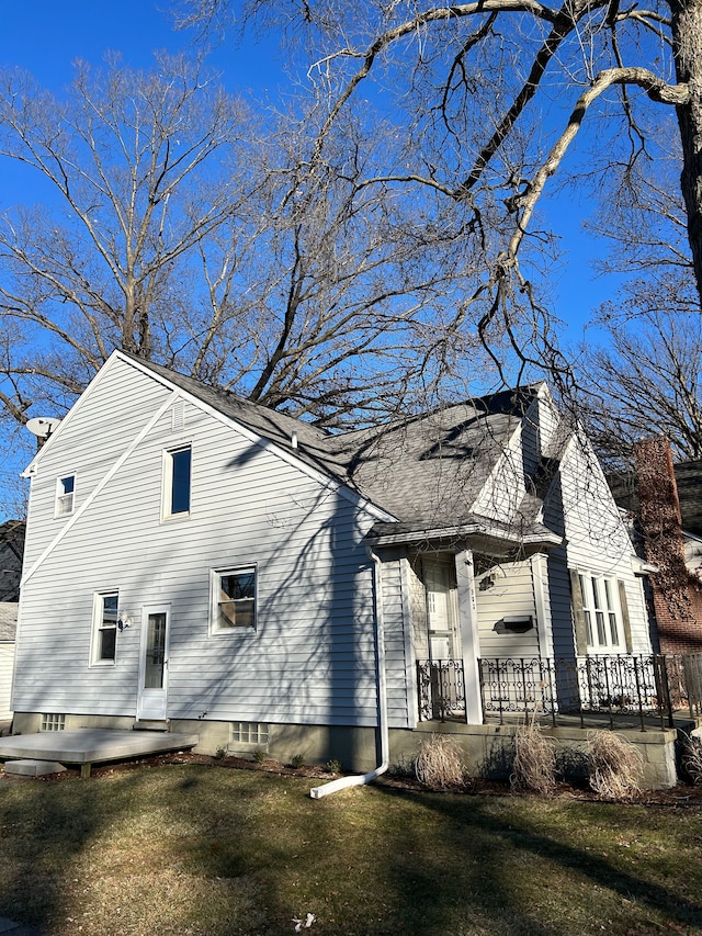 view of property exterior with a lawn