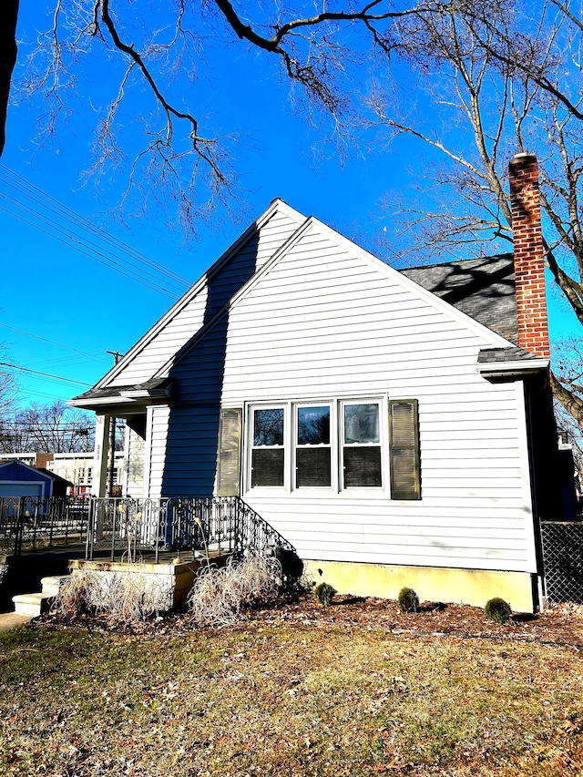 view of property exterior featuring a yard