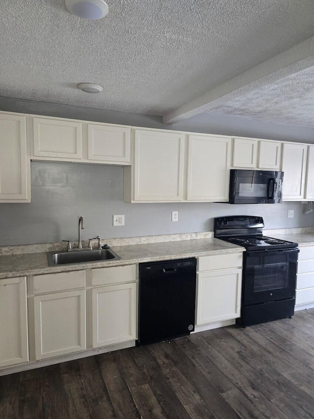 kitchen with black appliances, sink, a textured ceiling, dark hardwood / wood-style flooring, and white cabinetry