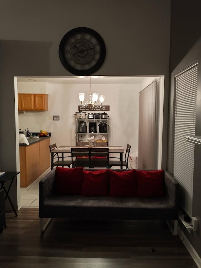 dining space with an inviting chandelier and tile patterned flooring