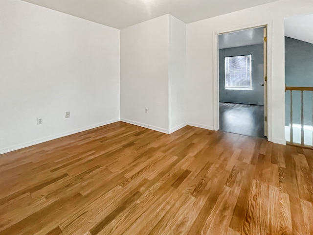 spare room with hardwood / wood-style flooring