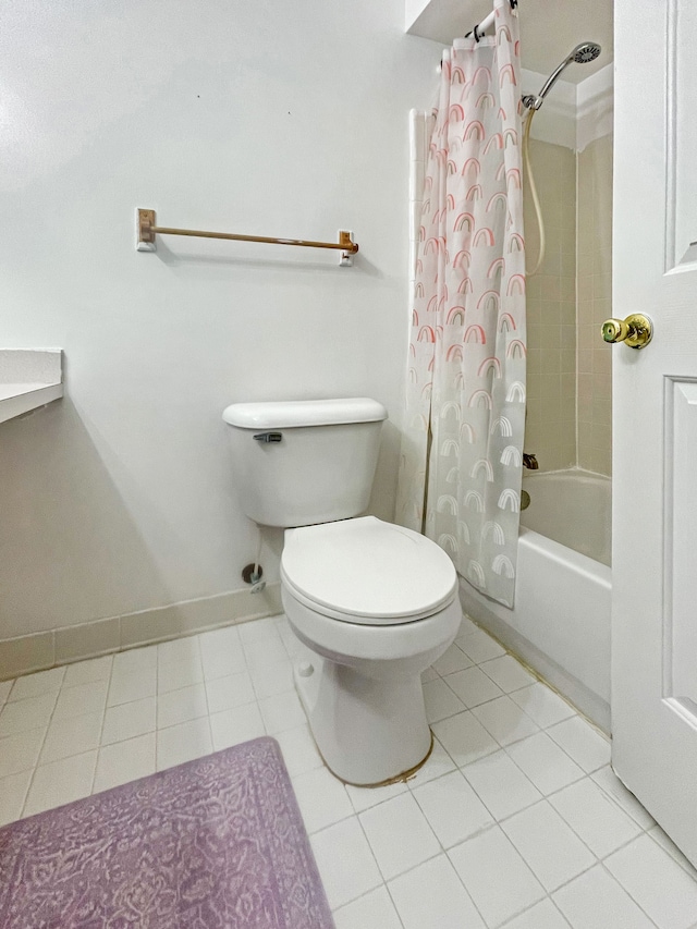 bathroom with tile patterned floors, toilet, and shower / bath combo with shower curtain