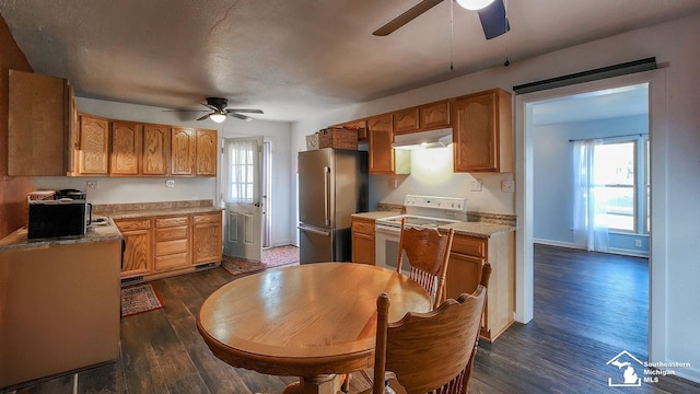 kitchen with ceiling fan, dark wood-type flooring, white stove, and high end refrigerator