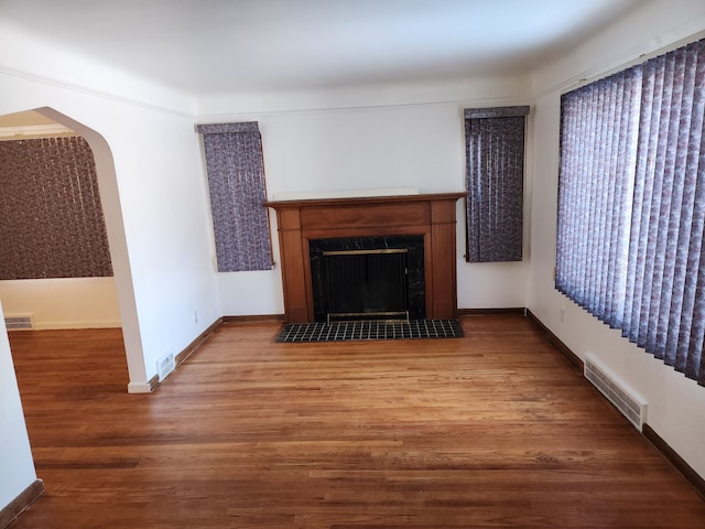 unfurnished living room featuring wood-type flooring