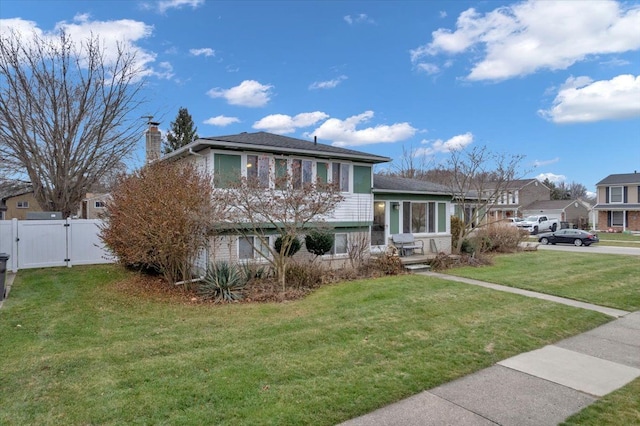 tri-level home featuring a front yard