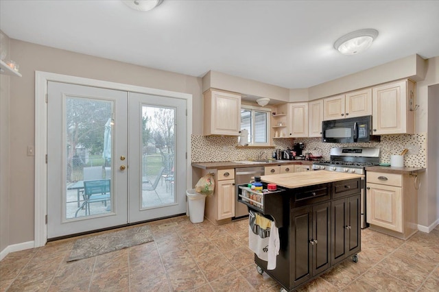 kitchen with a healthy amount of sunlight, french doors, and stainless steel appliances