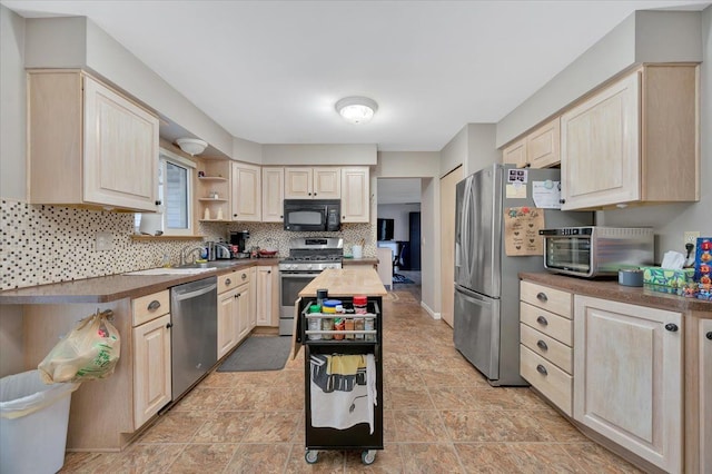 kitchen featuring wooden counters, appliances with stainless steel finishes, and backsplash