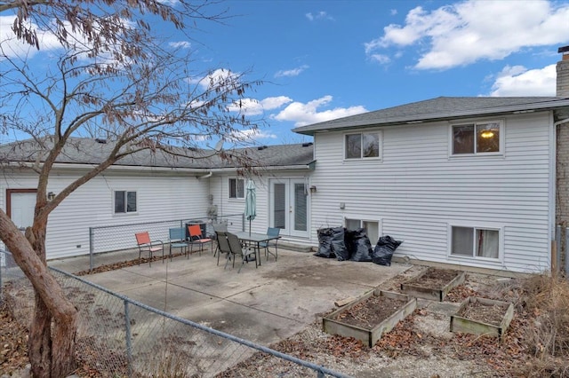 rear view of property with french doors