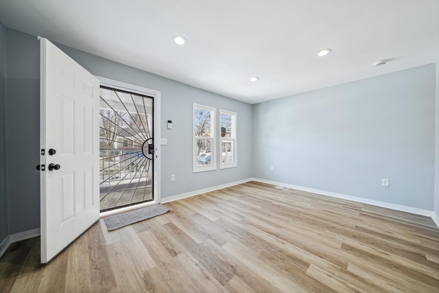 foyer entrance featuring light hardwood / wood-style flooring