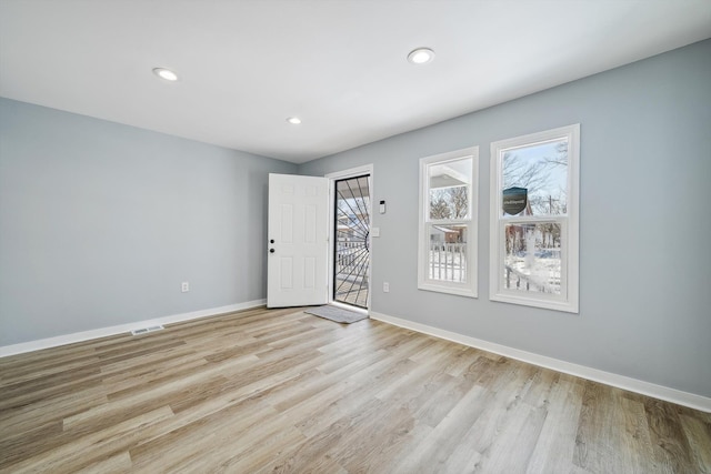 unfurnished room featuring light hardwood / wood-style flooring