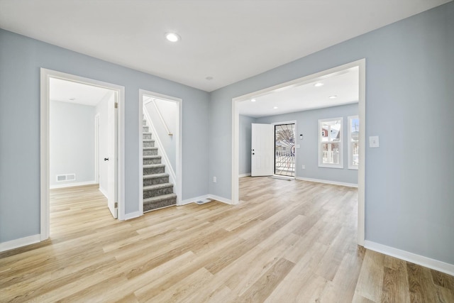 unfurnished living room featuring light hardwood / wood-style flooring