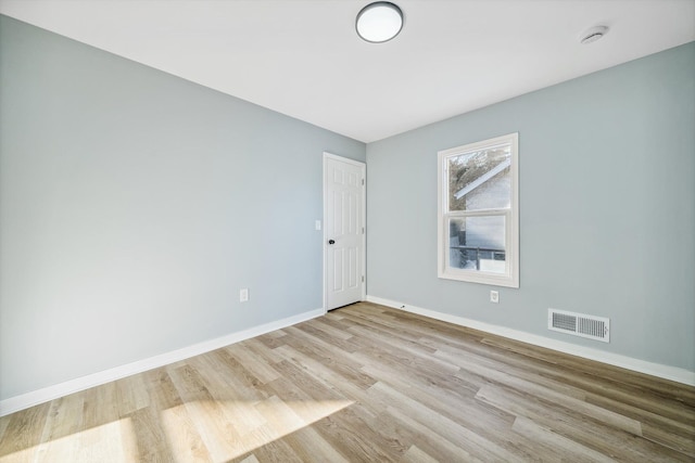 unfurnished room with light hardwood / wood-style flooring