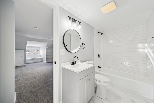 full bathroom with vanity, tiled shower / bath combo, and toilet