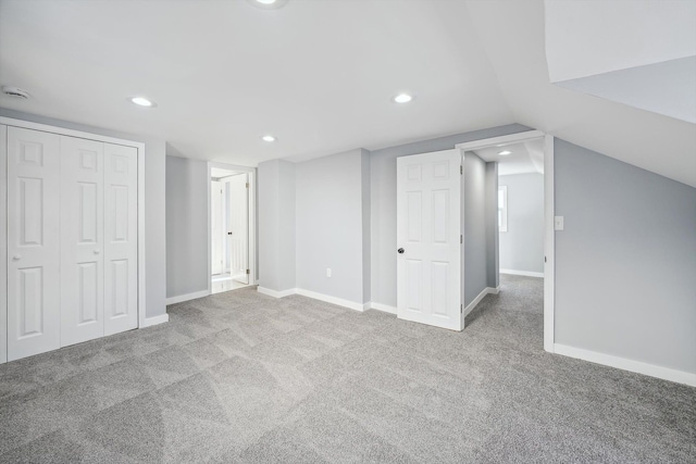 interior space featuring light carpet