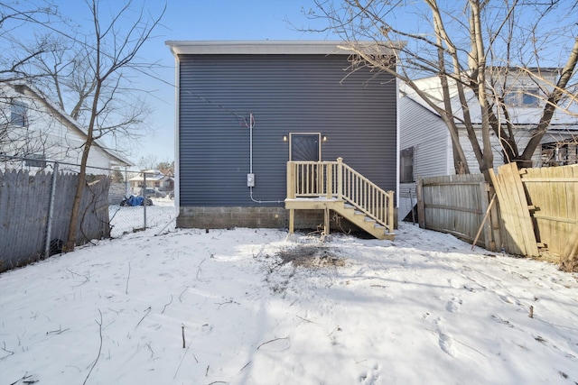 view of snow covered house