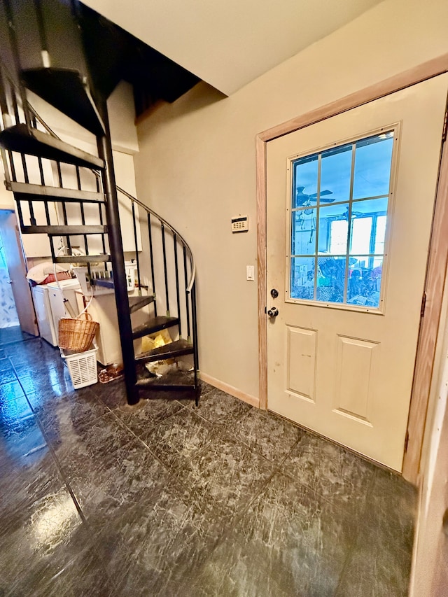 entryway with stairway and baseboards