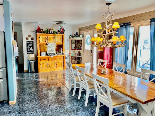 dining space featuring a chandelier and crown molding