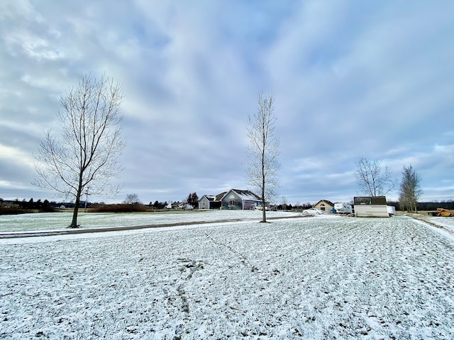 view of yard layered in snow