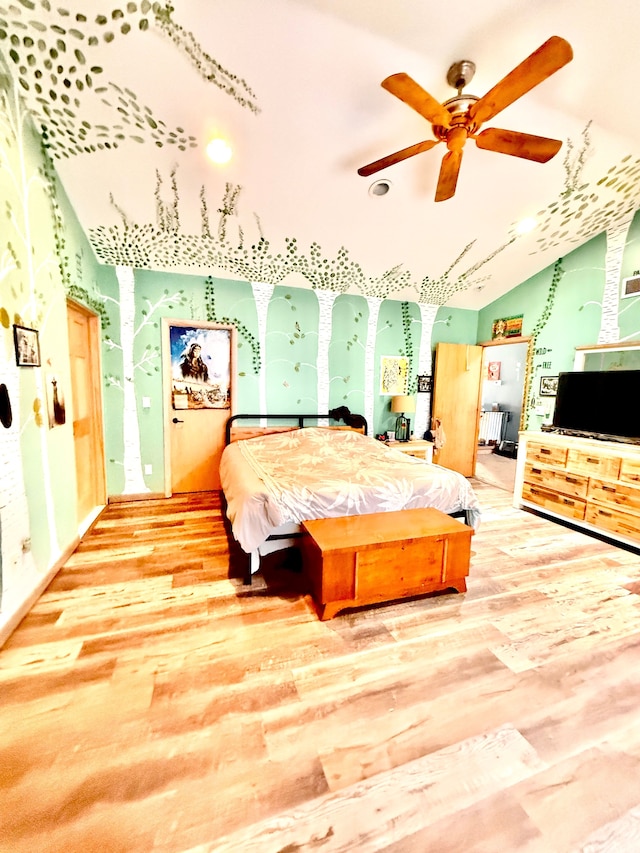 bedroom with hardwood / wood-style flooring and vaulted ceiling