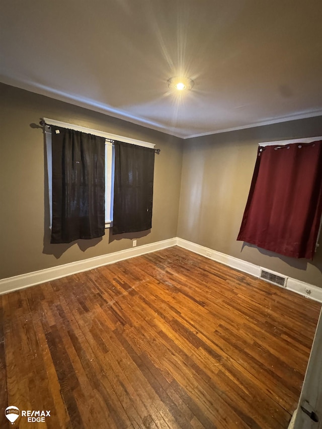 empty room with wood-type flooring