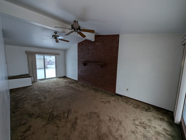 unfurnished living room featuring vaulted ceiling with beams, ceiling fan, a fireplace, and dark carpet