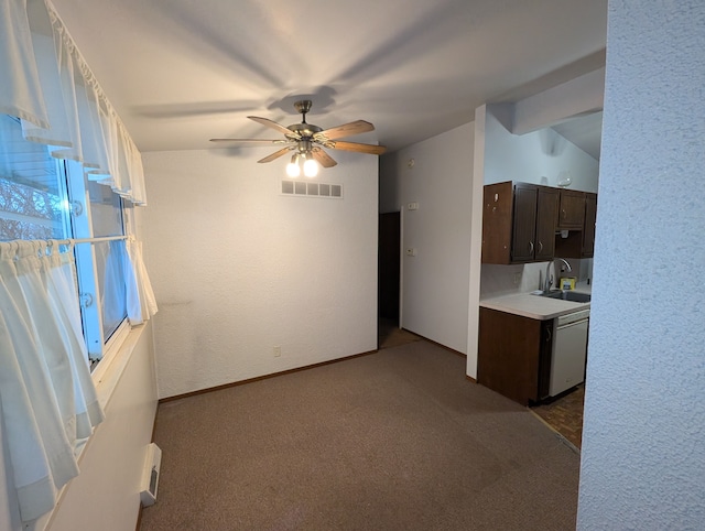 interior space featuring dishwasher, dark carpet, dark brown cabinets, and sink