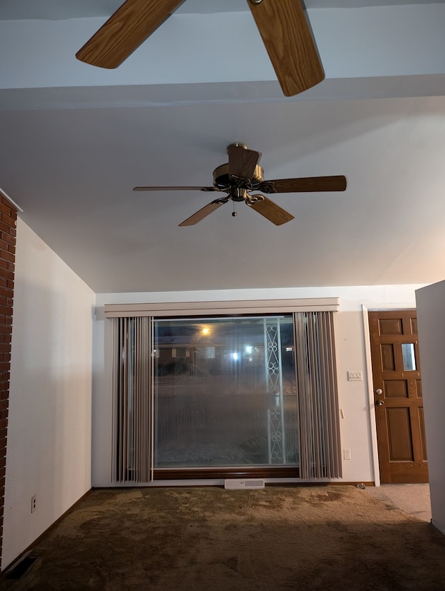 interior details with carpet, ceiling fan, and beamed ceiling