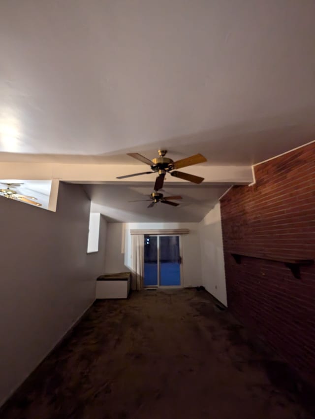 carpeted spare room featuring beamed ceiling and ceiling fan