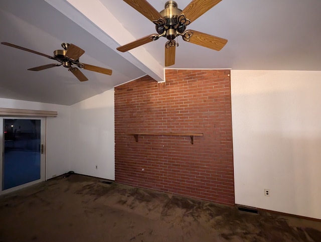 interior space featuring vaulted ceiling with beams, ceiling fan, brick wall, and dark colored carpet