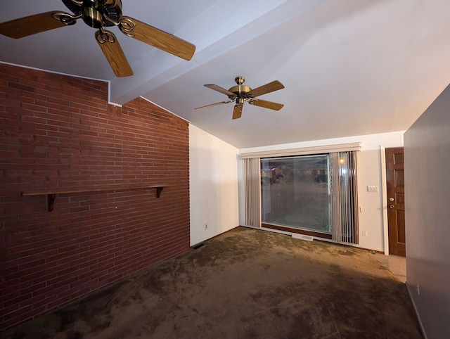 unfurnished living room with vaulted ceiling with beams, carpet floors, ceiling fan, and brick wall