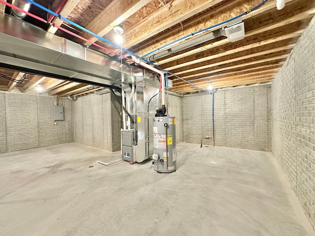 unfinished basement with heating unit, brick wall, electric panel, and gas water heater