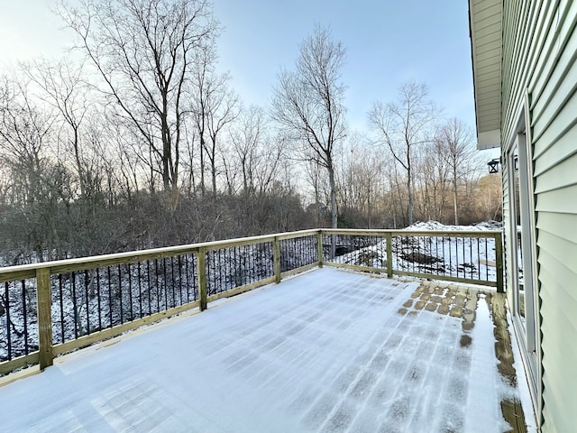 view of snow covered deck