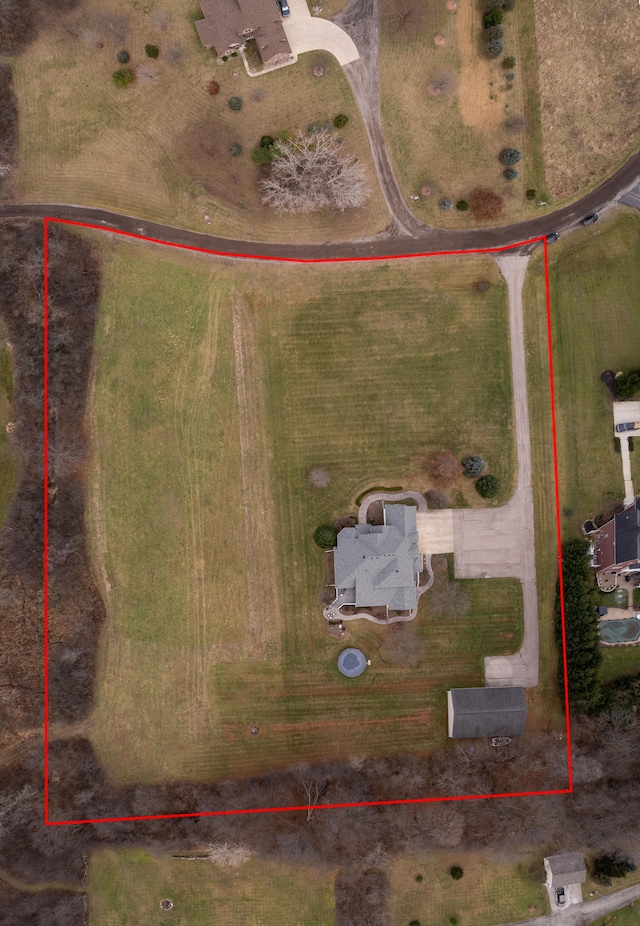 birds eye view of property with a rural view