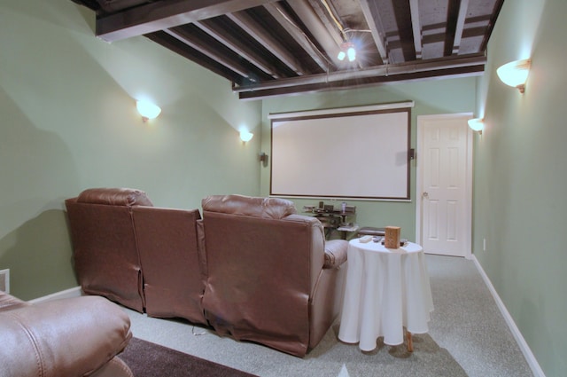 home theater with carpet and beam ceiling