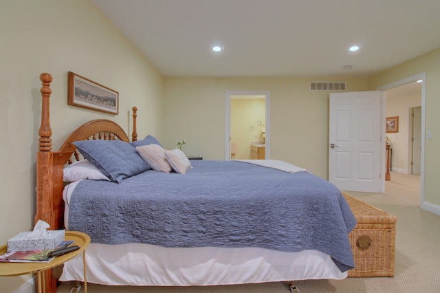 carpeted bedroom featuring connected bathroom