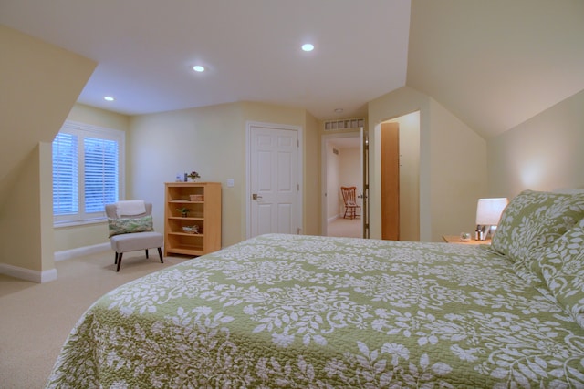 carpeted bedroom featuring lofted ceiling