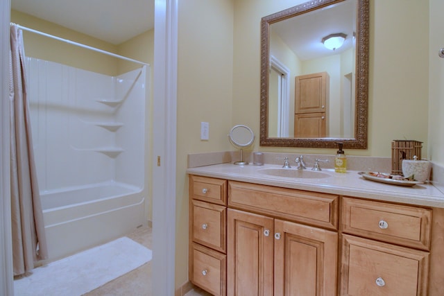 bathroom featuring shower / bath combo with shower curtain and vanity