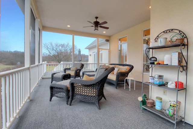 sunroom featuring ceiling fan