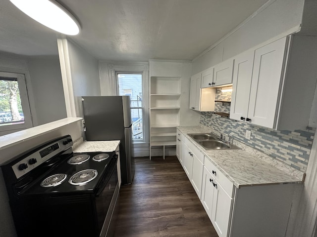 kitchen with electric range, sink, dark hardwood / wood-style floors, backsplash, and white cabinets