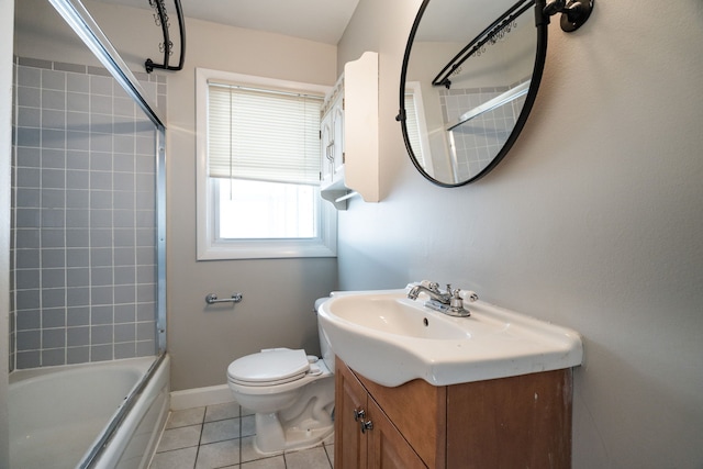 full bathroom featuring tile patterned floors, vanity, toilet, and shower / bath combination with glass door