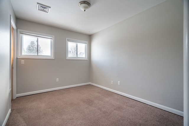 empty room featuring carpet floors