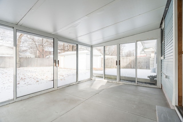 unfurnished sunroom with vaulted ceiling