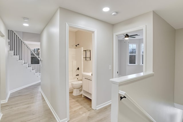 corridor featuring light hardwood / wood-style flooring